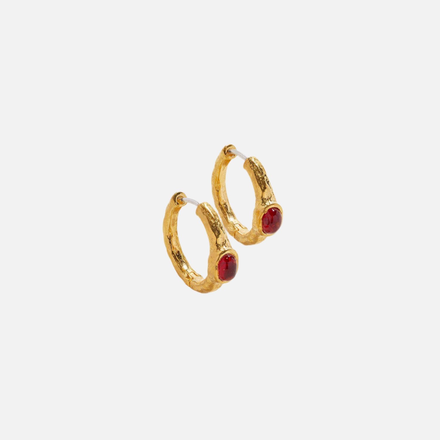 Gold hoop earrings by Pamela Love At Present Jewelry